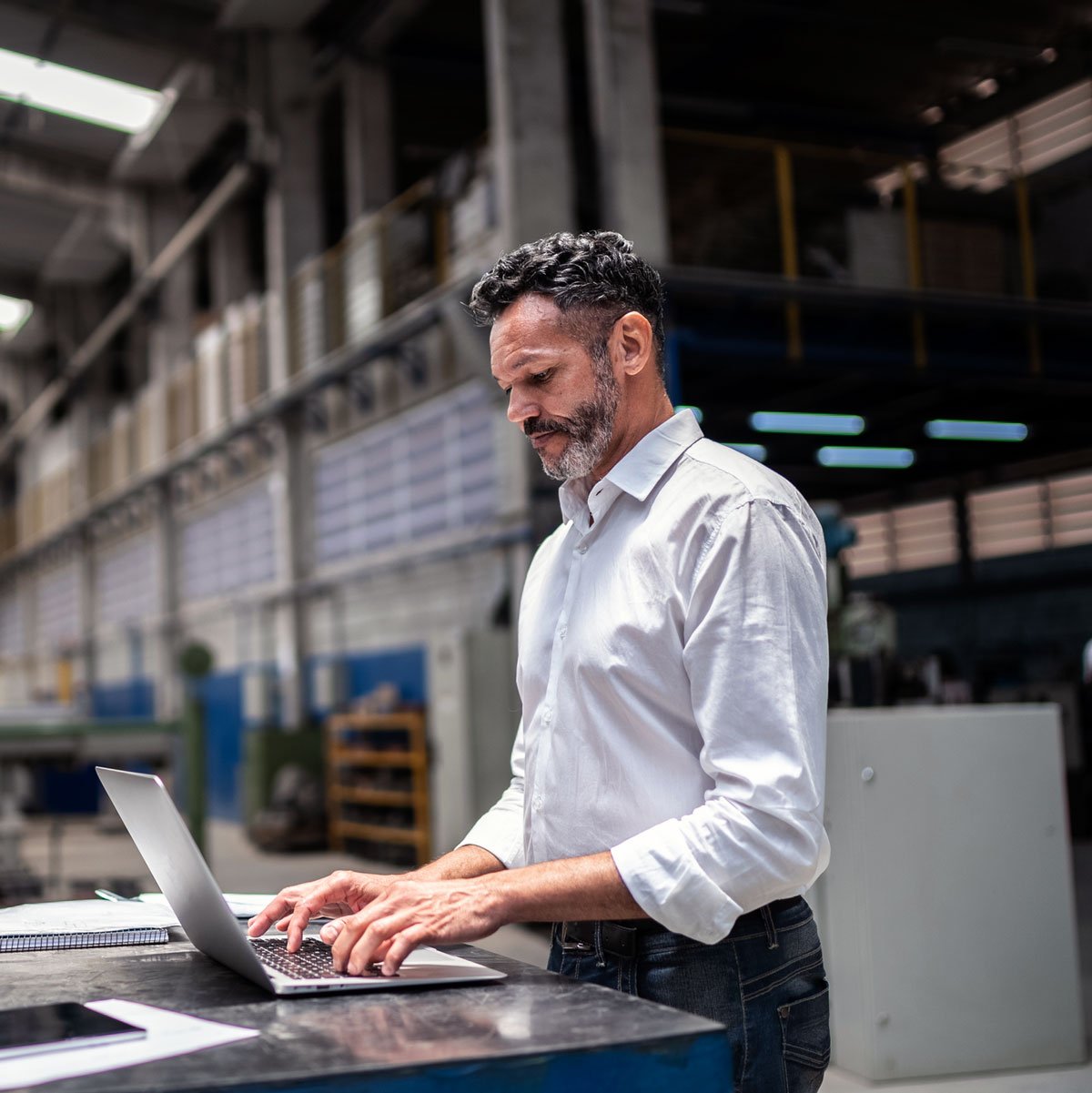 Factory Businessman Using Laptop
