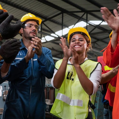 factory workers celebrating success
