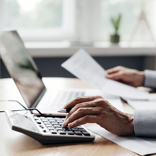 financial advisor using calculator
