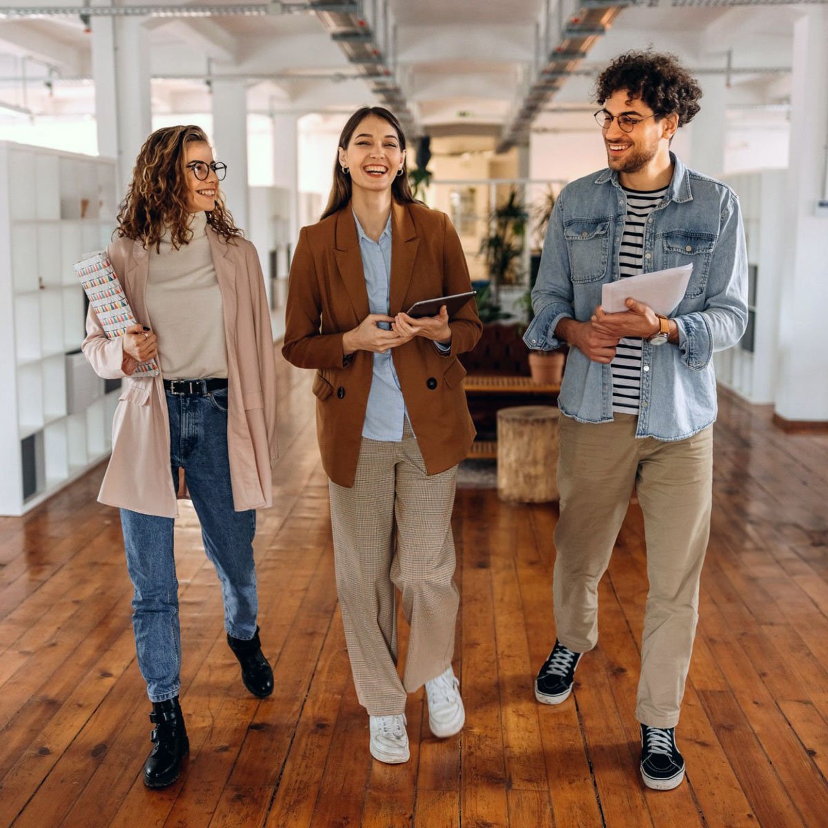 Group Of Smiling Colleagues Walking