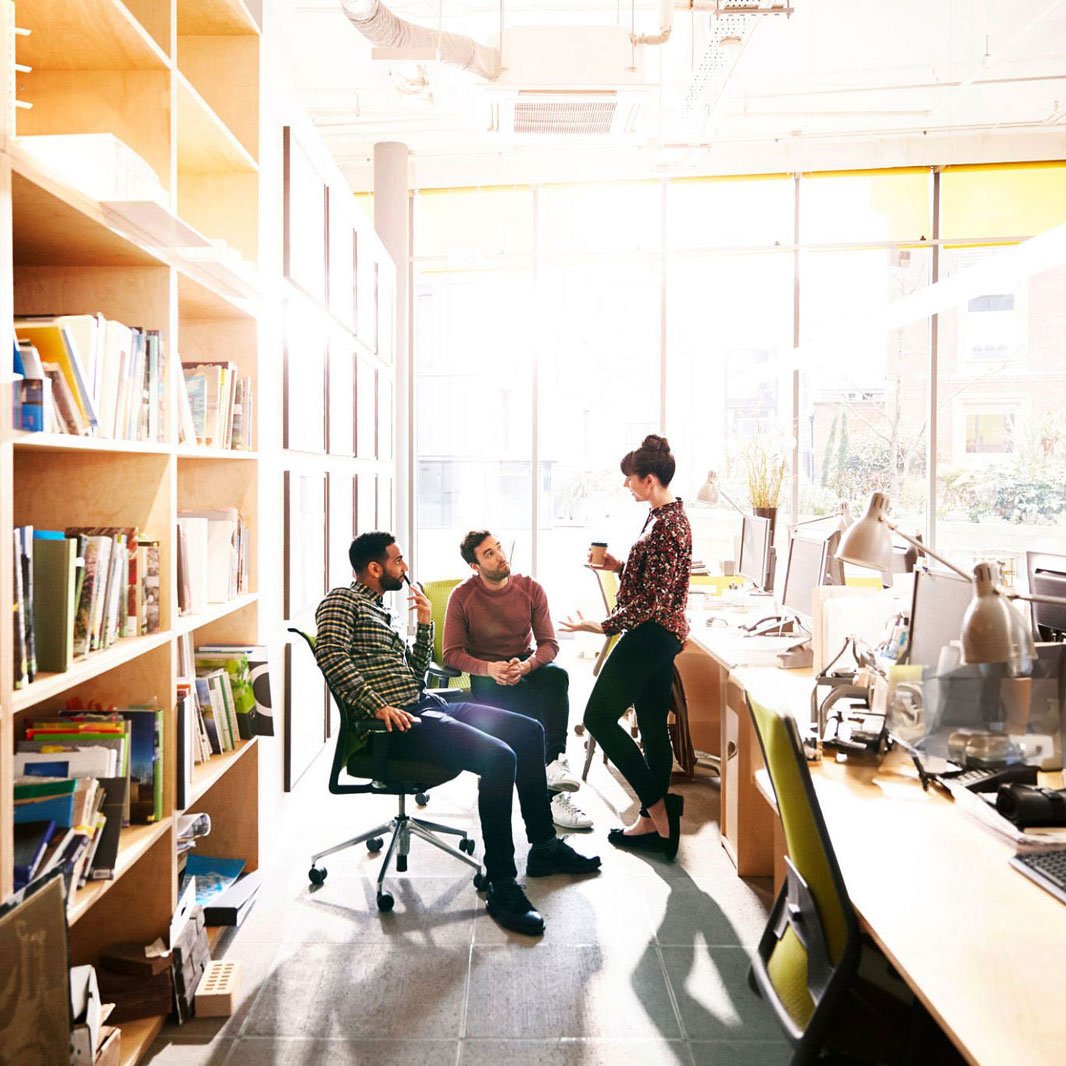 Three Employees Chatting