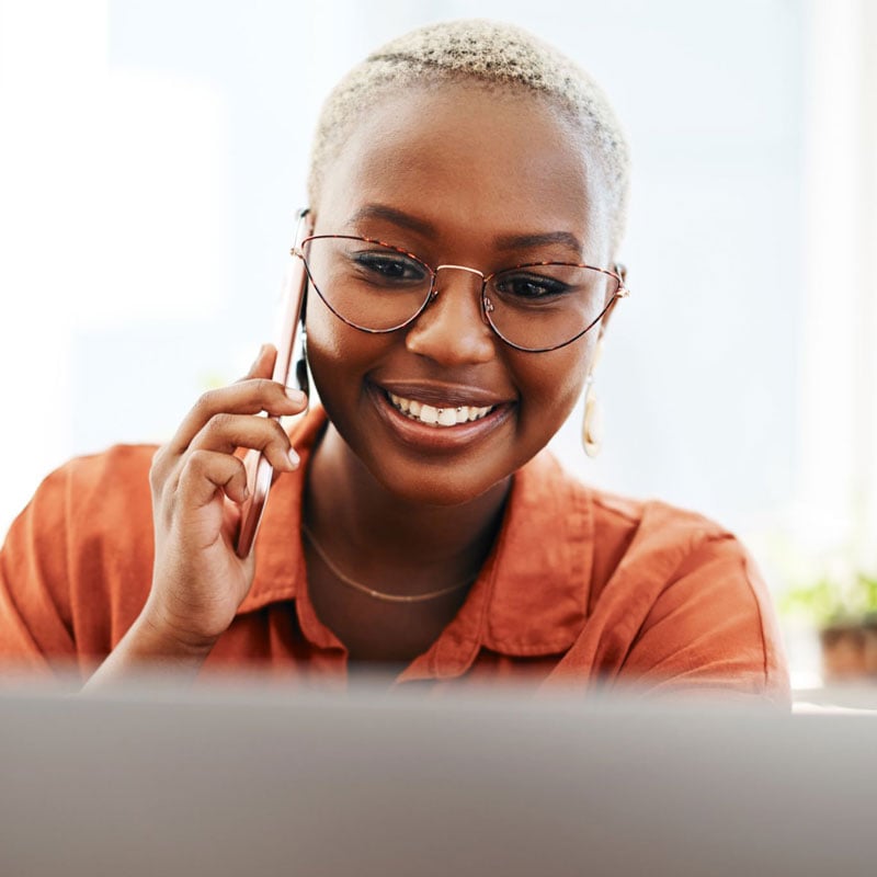 Smiling Worker On Computer