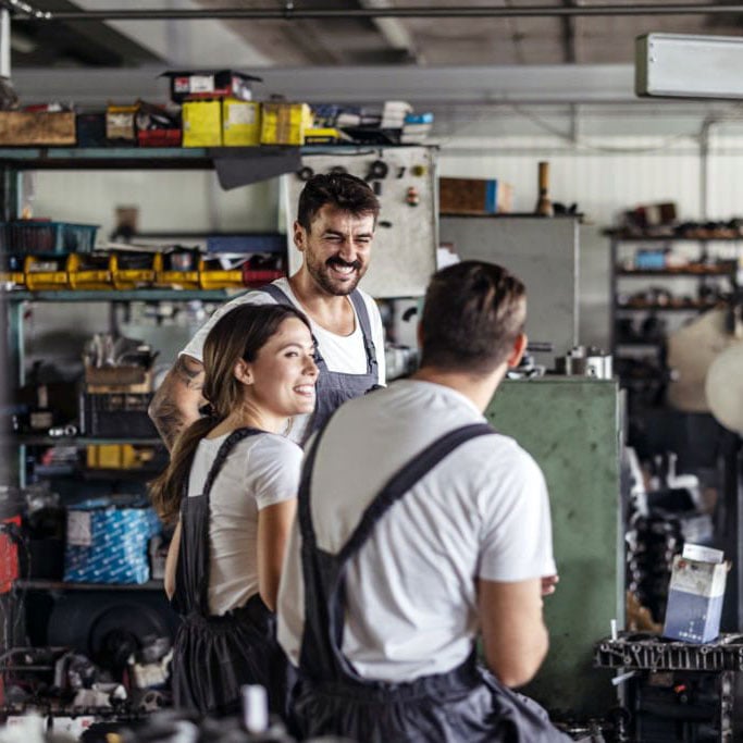 three mechanics talking