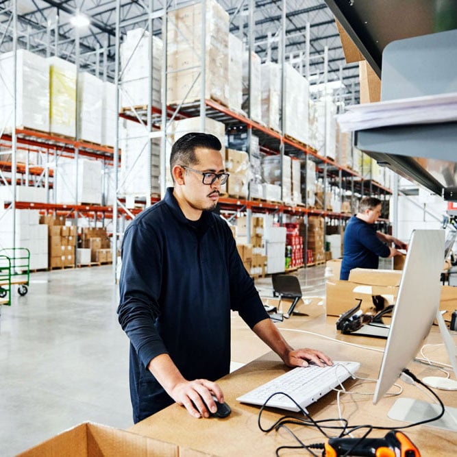 warehouse worker on computer