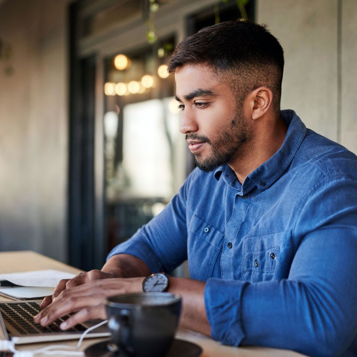 Employee typing on laptop