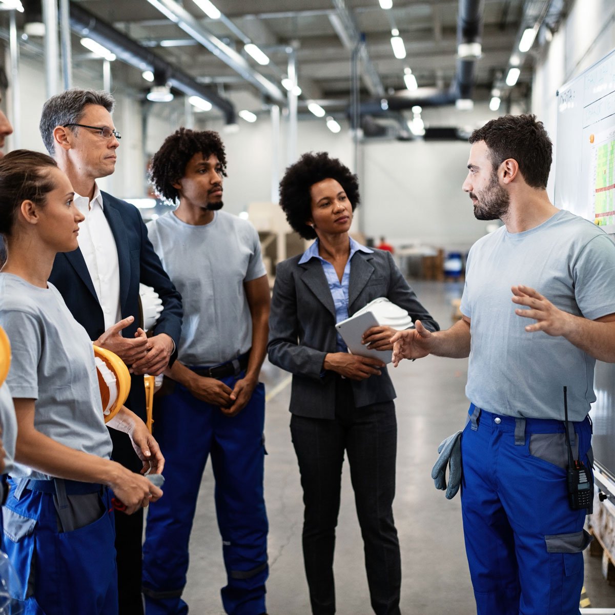 Workers In Meeting Factory