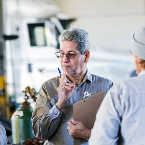 Employee holding clipboard