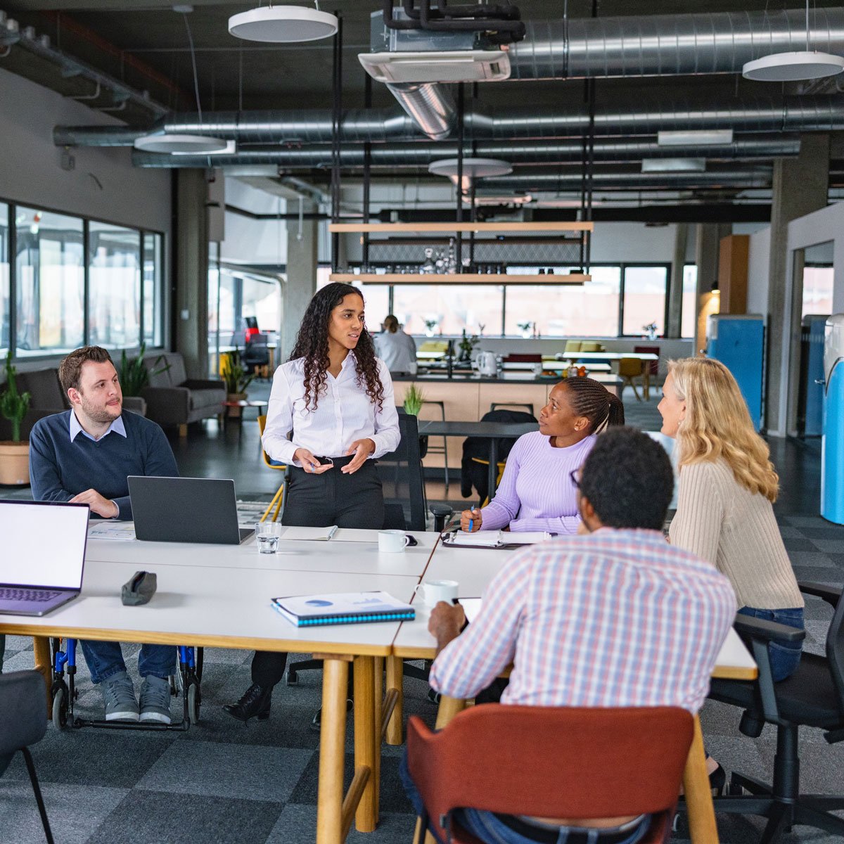 young business woman talking at meeting
